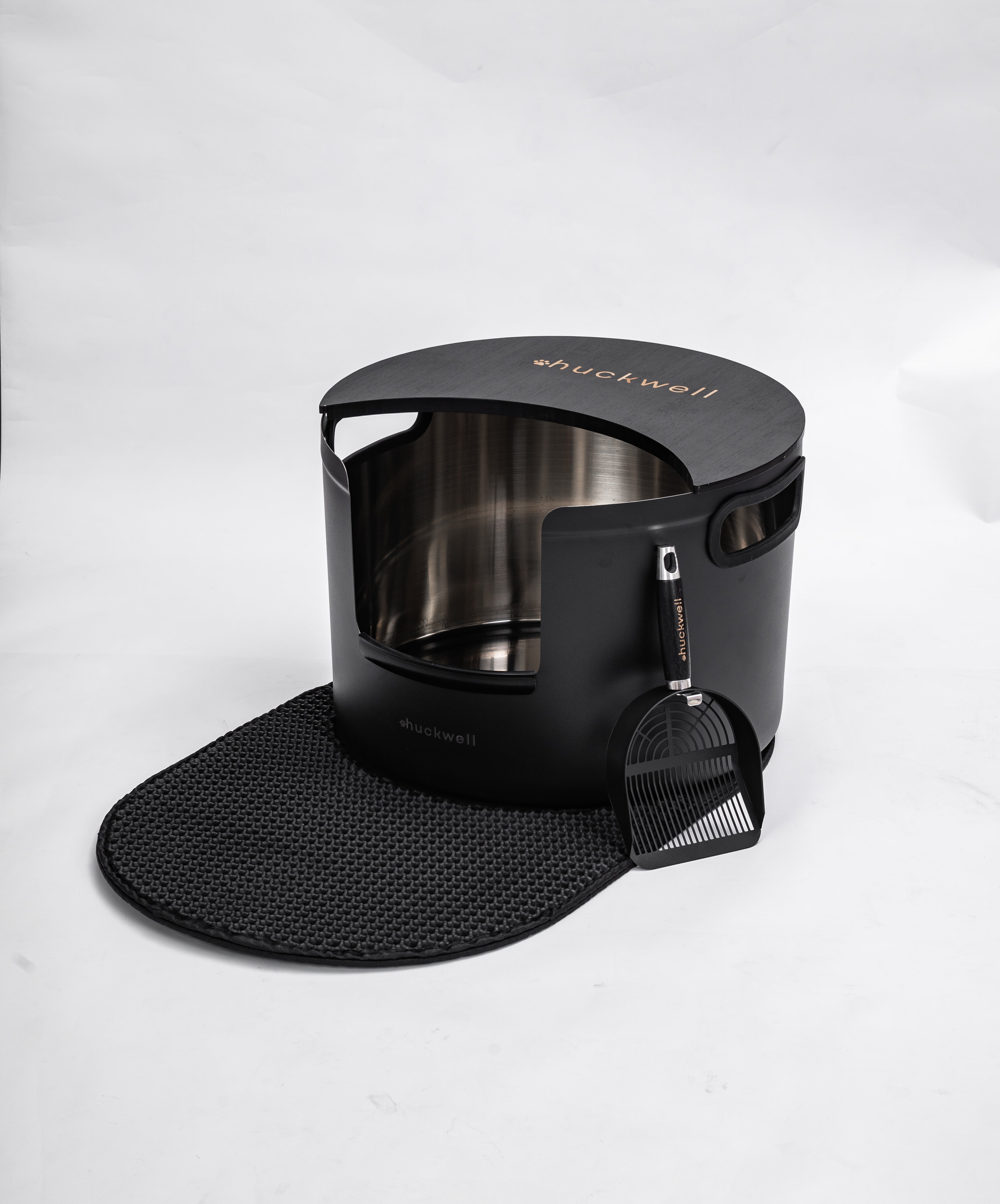 Halo Onyx round stainless steel litter box lifestyle shot in modern home